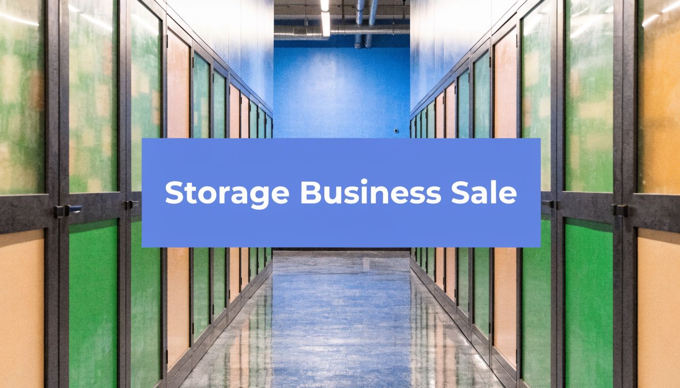 Hallway of a self-storage facility with blue, green, and yellow doors. A blue box with white text in the center reads 
